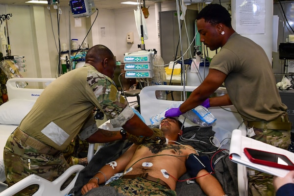 U.S. Army Capt. Renaldo Eugene and U.S. Army Spc. Taveon Taplin, assigned to105th Surgical Augmentation Detachment, tend to a simulated casualty during a mass casualty drill for Exercise Rim of Pacific (RIMPAC) 2026, July 10, 2026. Thirty nations, 30 ships, 5 submarines, 15 national land forces, more than 190 aircraft and more than 30,000 personnel are participating in RIMPAC in and around the Hawaiian Islands, June 24 to July 31. The world's largest international maritime exercise, RIMPAC provides a unique training opportunity while fostering and sustaining cooperative relationships among participants critical to ensuring the safety of sea lanes and security on the world's oceans. RIMPAC 2026 is the 30th exercise in the series that began in 1971. (U.S. Navy photo by Mass Communication Specialist 3rd Class Aaron J. Rolle)