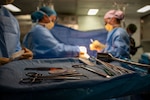 U.S. Army Capt. Danielle Patrick, assigned to Surgical Augmentation Detachment 105, and Hospitalman Lia Acostaguzman, assigned to Wasp-class amphibious assault ship USS Essex (LHD 2), perform a mock surgery during a mass casualty drill aboard Essex during Exercise Rim of the Pacific (RIMPAC) 2026, July 10, 2026. Thirty nations, 30 ships, 5 submarines, 15 national land forces, more than 2190 aircraft and more than 30,000 personnel are participating in RIMPAC in and around the Hawaiian Islands, June 24 to July 31. The world's largest international maritime exercise, RIMPAC provides a unique training opportunity while fostering and sustaining cooperative relationships among participants critical to ensuring the safety of sea lanes and security on the world's oceans. RIMPAC 2026 is the 30th exercise in the series that began in 1971. (U.S. Navy photo by Mass Communication Specialist Seaman Zachary Warr)