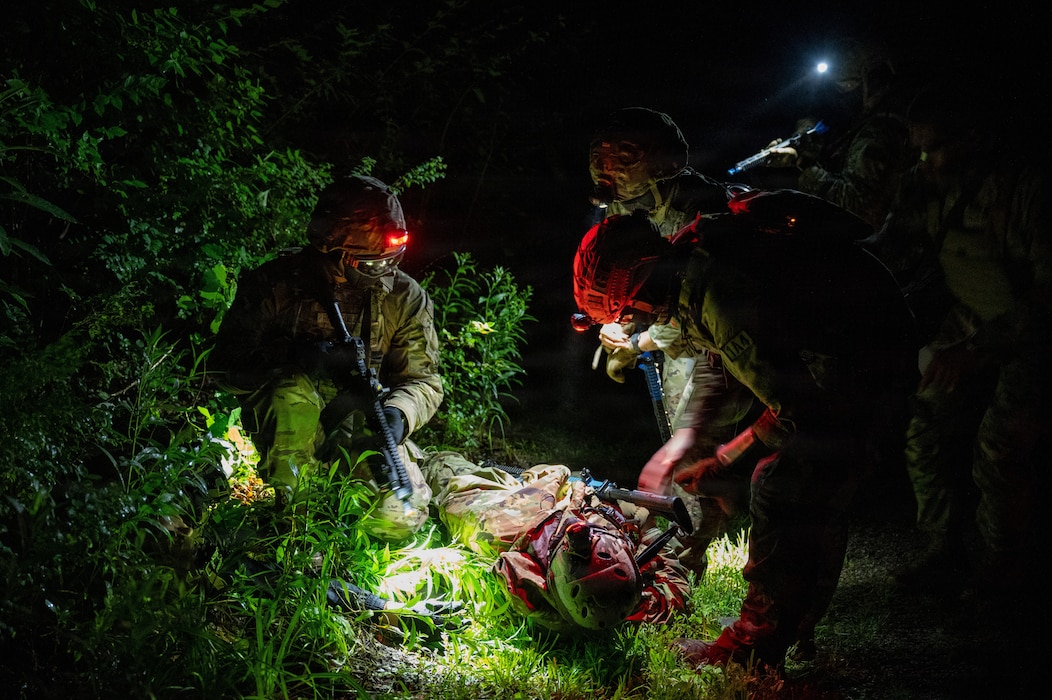 Airmen assigned to the 509th Logistics Readiness Squadron provide Tactical Combat Casualty Care during a field training exercise, June 25, 2026, at Whiteman Air Force Base, Mo. The exercise, which included dismounted ground combat and care-under-fire fundamentals, ensured Airmen are prepared to fight, survive, and win in contested environments. (U.S. Air Force photo by 2nd Lt. Nicholas Moreno)