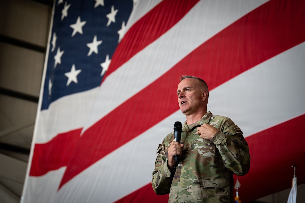 Chief Master Sgt. of the Air Force David Wolfe answers questions during an all-call at RAF Mildenhall, United Kingdom, July 13, 2026. Wolfe discussed mission readiness, innovation, and developing the next generation of Airmen. (U.S. Air Force photo by Airman 1st Class Chloe Masey)