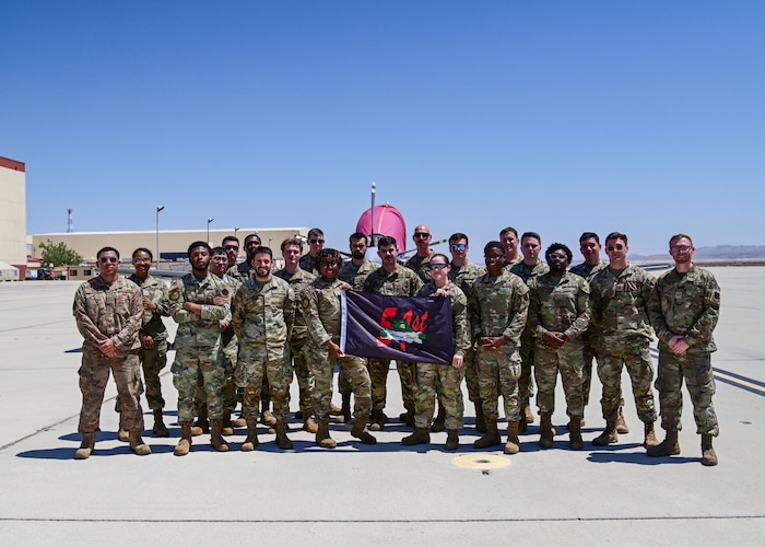 A group of military personnel pose for a group photo