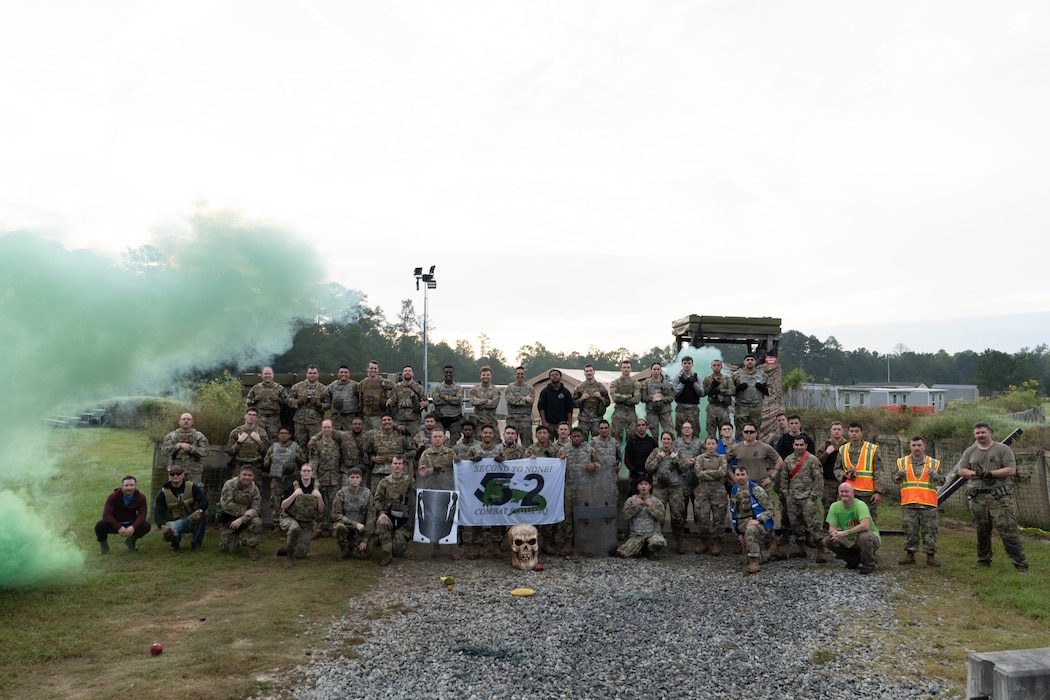 A group of military personnel pose for a group photo