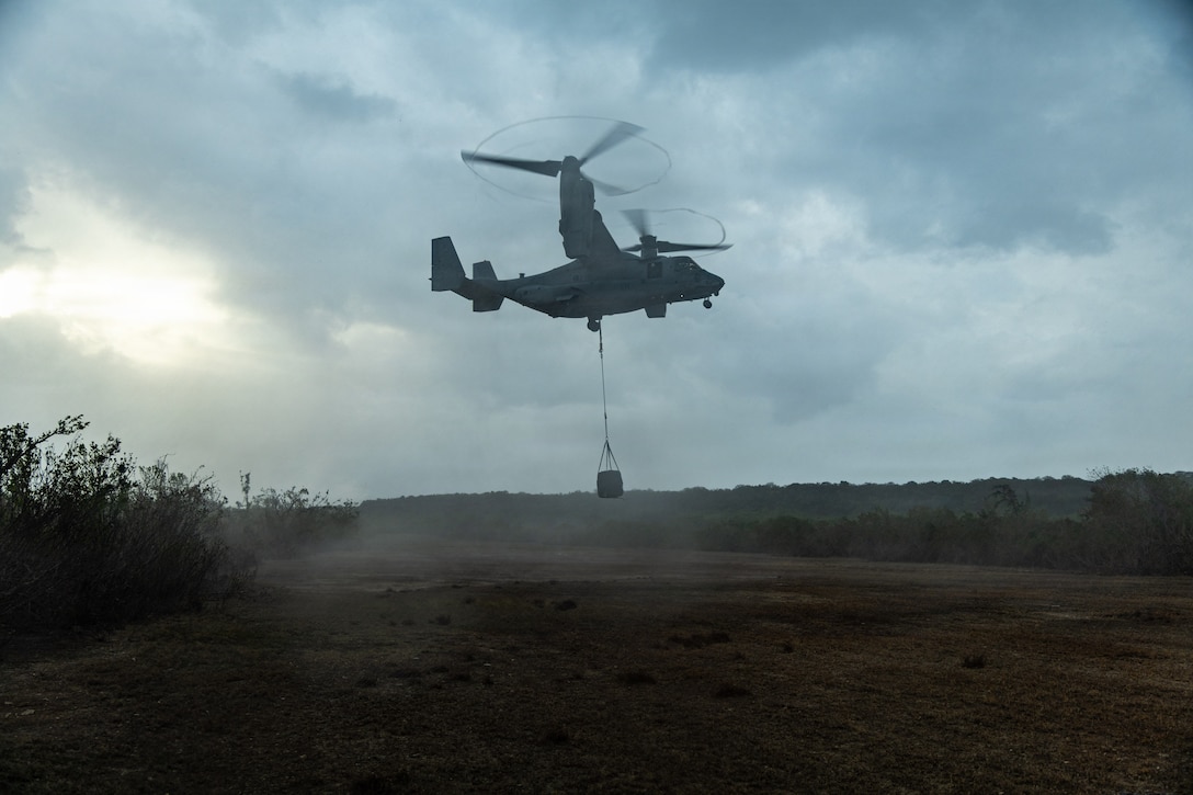 U.S. Marine Corps MV-22B Osprey tiltrotor aircraft, assigned to Marine Medium Tiltrotor Squadron (VMM) 365 (Reinforced), Littoral Combat Force 24, lifts a training load during a helicopter support team sling load training on Mona Island, Puerto Rico, July 16, 2026. U.S. military forces are deployed to the U.S. Southern Command area of responsibility in support of Operation SOUTHERN SPEAR, Department of War-directed operations, and the president’s priorities to disrupt illicit drug trafficking, deter malign actors and protect the homeland through continuous presence. (U.S. Marine Corps photo)