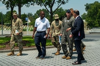 U.S. Air Force Maj. Gen. walks with JBAB leadership at the Air Force Memorial