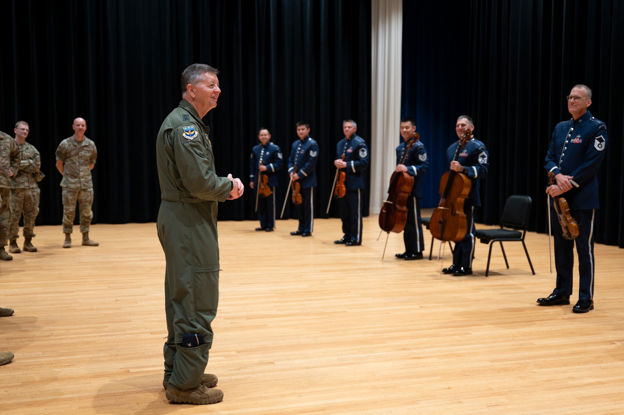 U.S. Air Force Maj. Gen. stands in front of The Band musicians