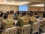 U.S. Airmen with the Air National Guard assigned to force support squadrons from Colorado, Nevada, Oregon and Puerto Rico, attend a briefing during the fiscal year 2026 Home Station Readiness Training at Joint Base Pearl Harbor-Hickam, Hawaii, June 16, 2026. The Home Station Readiness Training is a joint total force integration training involving the 140th Force Support Squadron, 154th Force Support Squadron, 142nd Force Support Squadron, 926th Force Support Squadron and 156th Force Support Squadron, designed to test participants expeditionary capabilities and ensure that force support personnel are prepared to perform their mission in a contested environment. Courtesy photo.