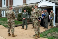U.S. Air Force Maj. Gen. stands in front of building with JBAB leadership