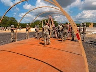 U.S. Airmen with the Air National Guard assigned to force support squadrons from Colorado, Nevada, Oregon, and Puerto Rico, assemble a tent during the fiscal year 2026 Home Station Readiness Training at Joint Base Pearl Harbor-Hickam, Hawaii, June 17, 2026.