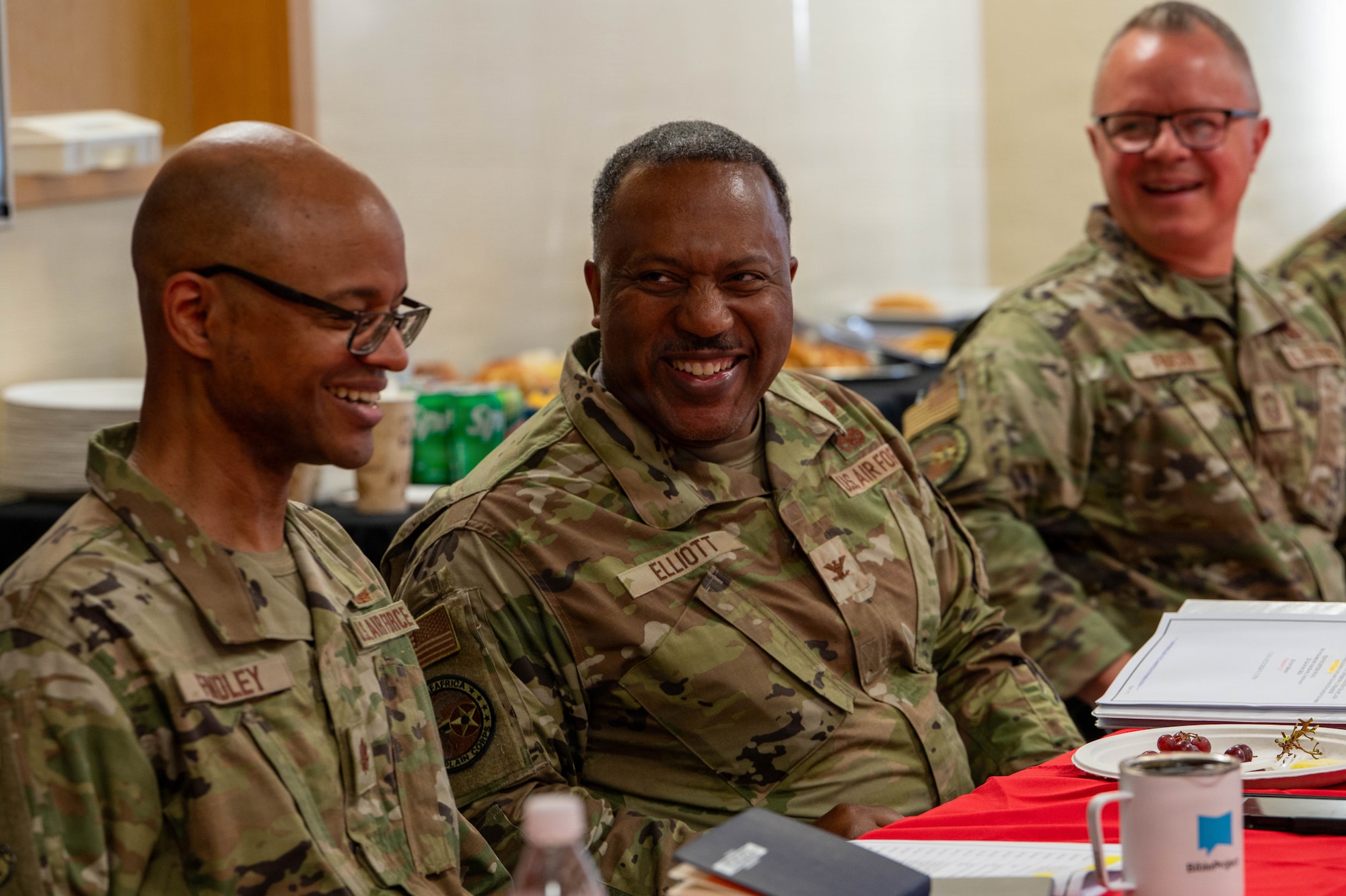 U.S. Air Force Col. Ralph Elliott, center, Europe-Air Forces Africa command chaplain, engages in discussion with U.S. Air Force Maj. Alan Findley, left, 52nd Fighter Wing chaplain, during a visit at Spangdahlem Air Base, Germany, June 24, 2026. The visit provided an opportunity to connect with chapel personnel, discuss religious support initiatives and reinforce the role of spiritual readiness. (U.S. Air Force photo by Airman 1st Class Kacie Ramos)