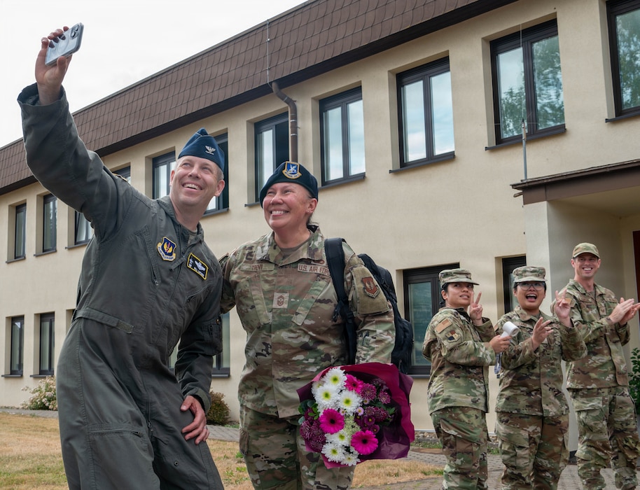 U.S. Air Force members clap.
