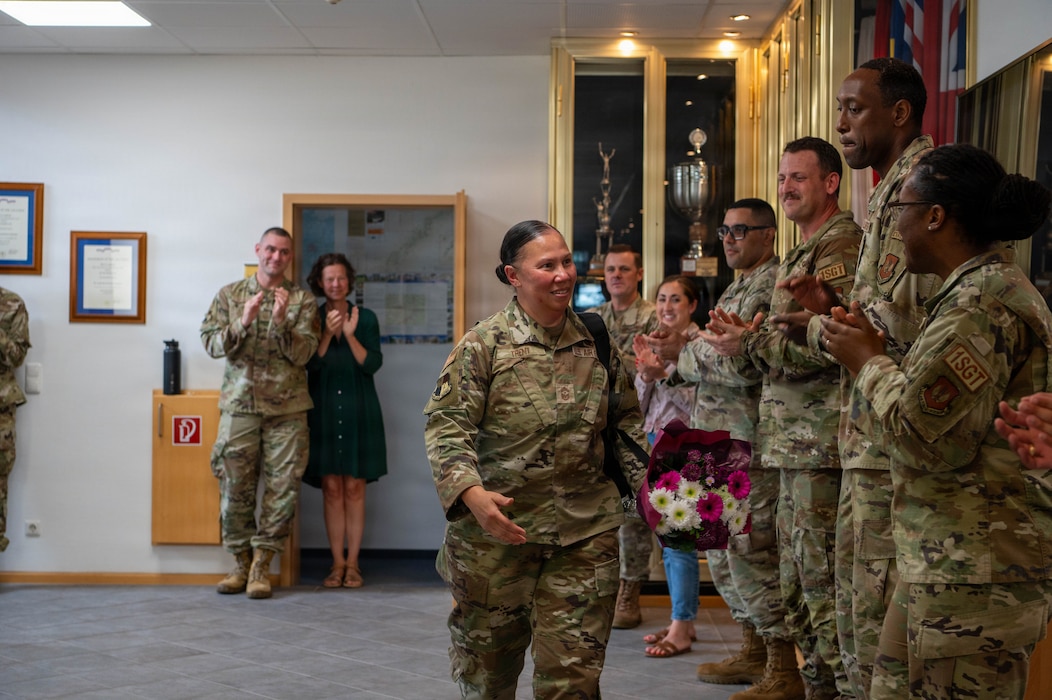 U.S. Air Force members clap.
