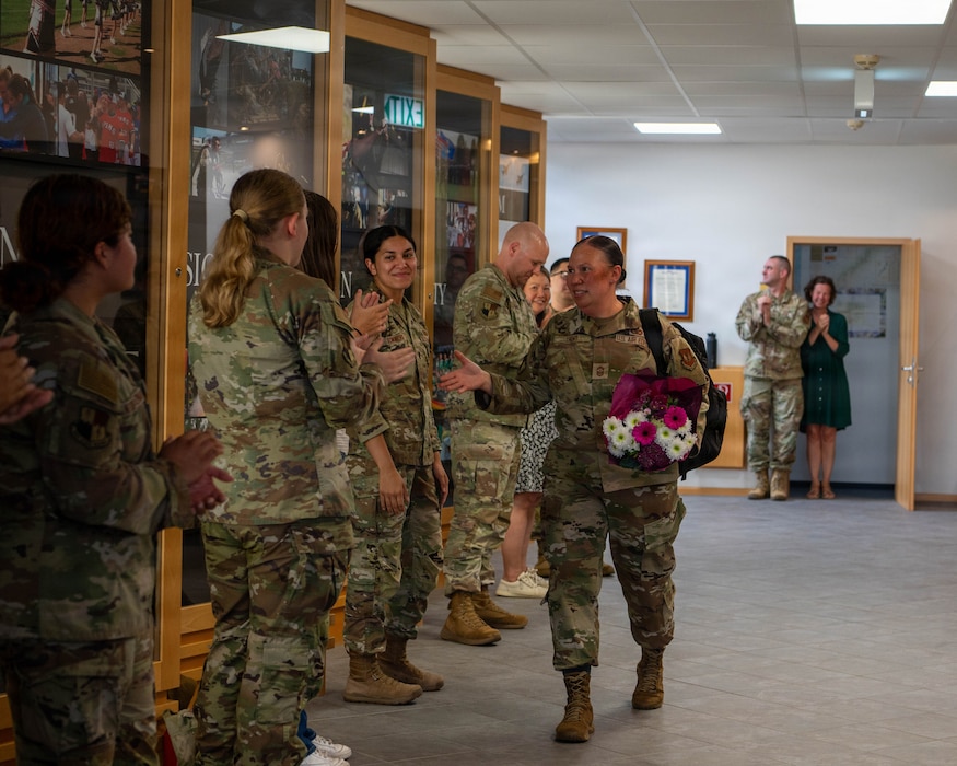 U.S. Air Force members clap.