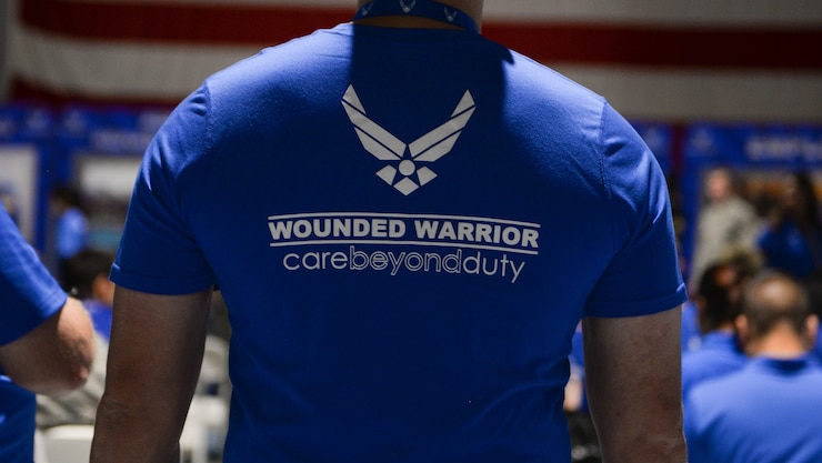 A wounded warrior watches the opening ceremony of the Air Force Wounded Warrior Program’s Warrior CARE Event and Warrior Games team training camp inside the Offutt Field House Aug. 1, 2017 at Offutt Air Force Base, Neb. Wounded Warriors is an adaptive sports competition for wounded, ill and injured service members and veterans. (U.S. Air Force photo by Zachary Hada)