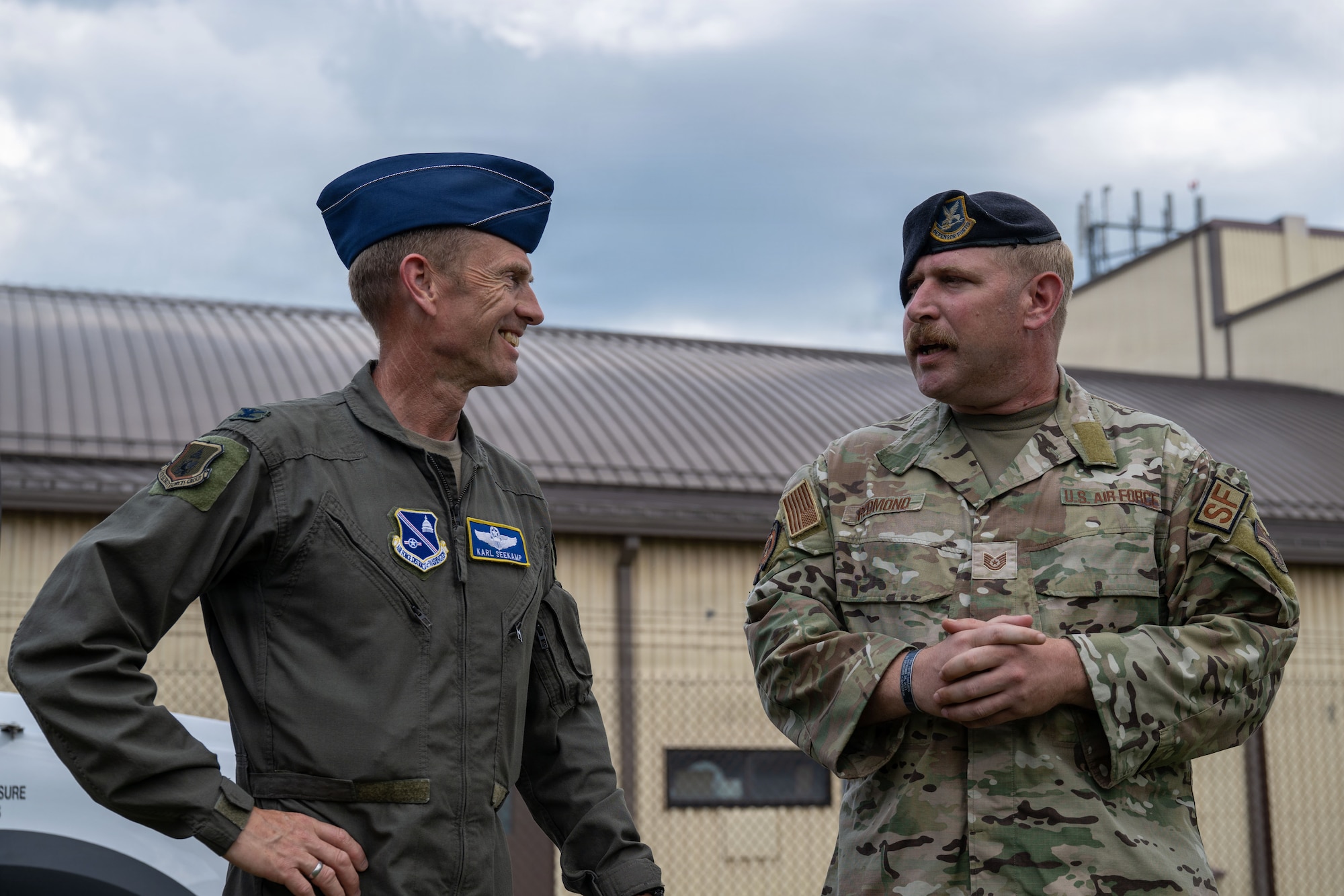 U.S. Air Force Col. Karl W. Seekamp, 316th Wing and installation commander, left, talks with Tech. Sgt. Andrew Redmon, a defender assigned to the 316th Security Forces Squadron, during his wing immersion.