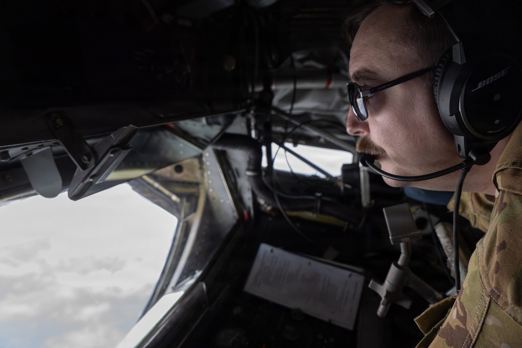 U.S. Air Force Tech. Sgt. Colin Leavens, a boom operator assigned to the 91st Air Refueling Squadron, prepares to refuel an aircraft during a training flight over the southeastern region of the United States, June 30, 2026. Regular training prepares aircrews to provide rapid global reach in support of joint and coalition operations. (U.S. Air Force photo by Airman 1st Class Helen Ly)