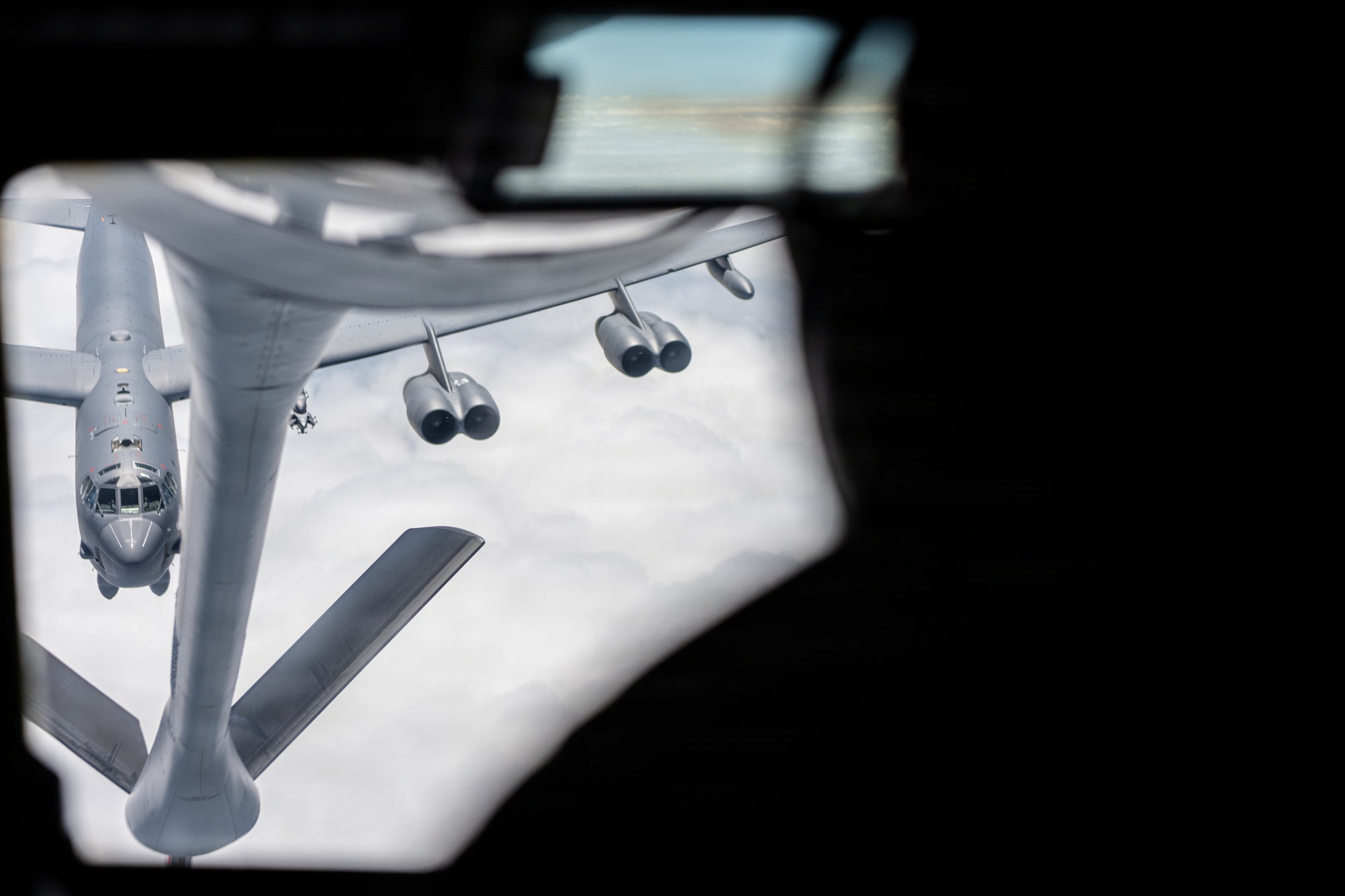 A U.S. Air Force B-52 Stratofortress assigned to the 2nd Bomb Wing approaches a KC-135 Stratotanker assigned to the 6th Air Refueling Wing for in-flight refueling over the southeastern region of the United States, June 30, 2026. The 6th ARW strengthens interoperability by training with a variety of aircraft and squadrons, ensuring readiness to support global operations anywhere, anytime. (U.S. Air Force photo by Airman 1st Class Helen Ly)