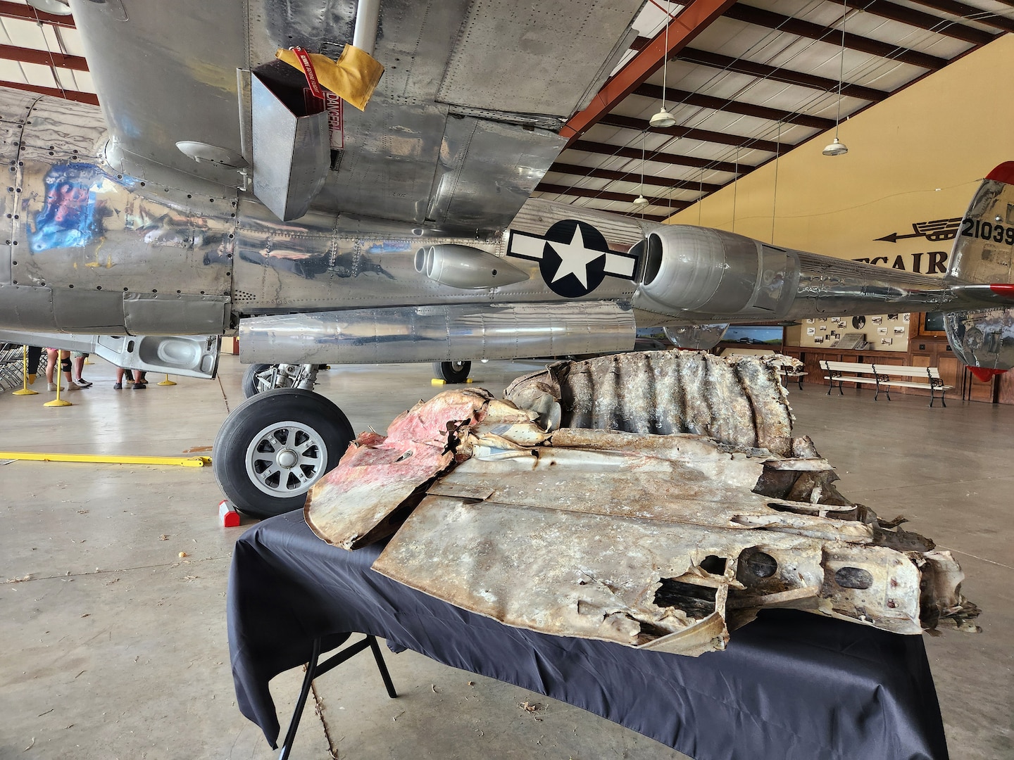 A fragment of a World War II P‑38 Lightning aircraft is displayed at the Experimental Aircraft Association’s AirVenture in Oshkosh, Wisconsin, July 23, 2026.