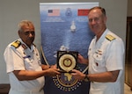 260721-N-JT705-1426 RABAT, MOROCCO (July 21, 2026) Adm. George Wikoff, Commander, U.S. Naval Forces Europe and Africa with Rear Adm. Abdelhafih Mohamed Hassan Alareibi, Deputy Chief of Naval Staff, Libyan National Army, take part in a cultural gift exchange during African Maritime Forces Summit (AMFS). Co-hosted by the Royal Moroccan Armed Forces, U.S. Naval Forces Africa, and U.S. Marine Corps Forces, Europe and Africa, AMFS 2026 brings together international partners to address shared security challenges under the theme 
