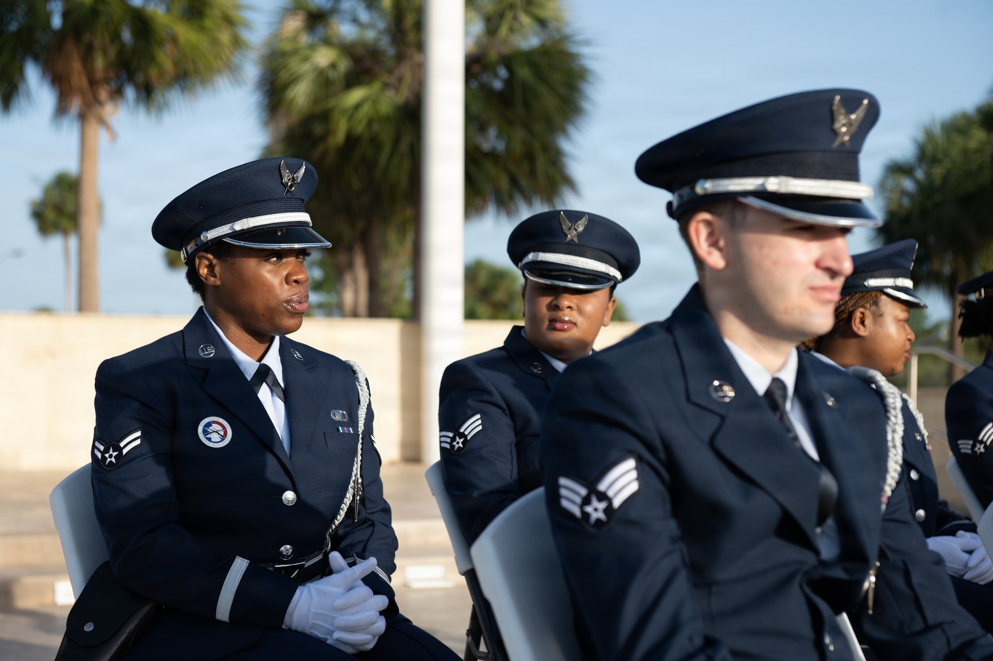 U.S. Air Force Airman 1st Class Autumn Lindor, 6th Force Support Squadron ceremonial guardsman, is seated for a base honor guard induction ceremony at MacDill Air Force Base, Florida, July 22, 2026. Base Honor Guardsmen train for two weeks to master ceremonial skills such as pallbearing, presentation of flags, firing party drill and others. Guardsmen must prove their mastery of each skill to become inducted into the team. (U.S. Air Force photo by Senior Airman Derrick Bole)