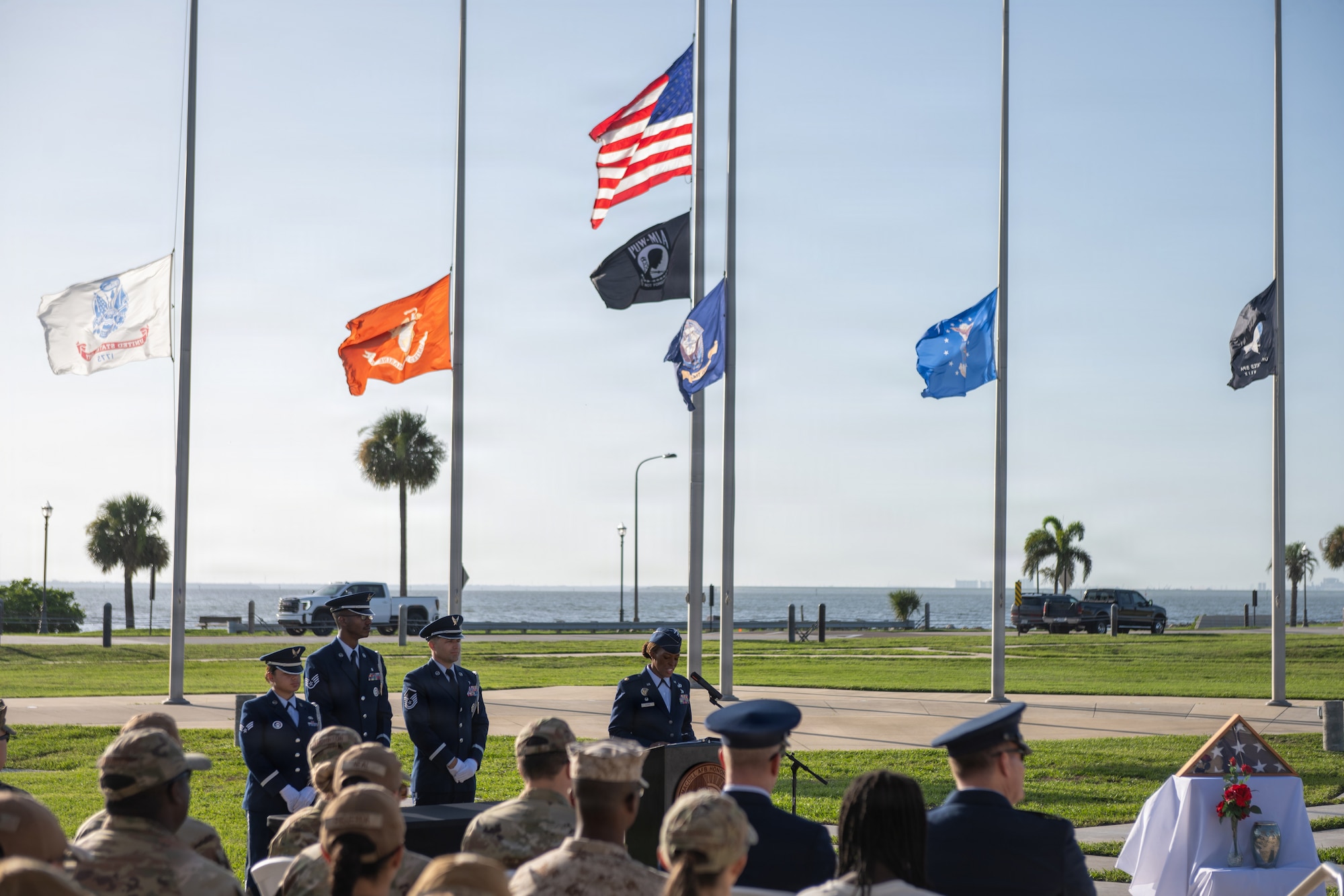 U.S. Air Force Maj. Kenda Gusme, 6th Force Support Squadron commander, addresses a crowd of attendees during a base honor guard induction ceremony at MacDill Air Force Base, Florida, July 22, 2026. Gusme served both in the USAF Honor Guard and the base honor guard at Spangdalem Air Force Base, Germany, and impressed upon the new guardsmen the importance of their position. (U.S. Air Force photo by Senior Airman Derrick Bole)
