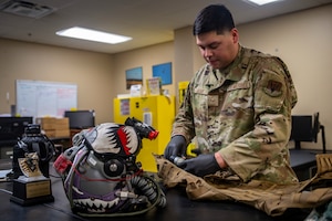 Airman inspects flight gear
