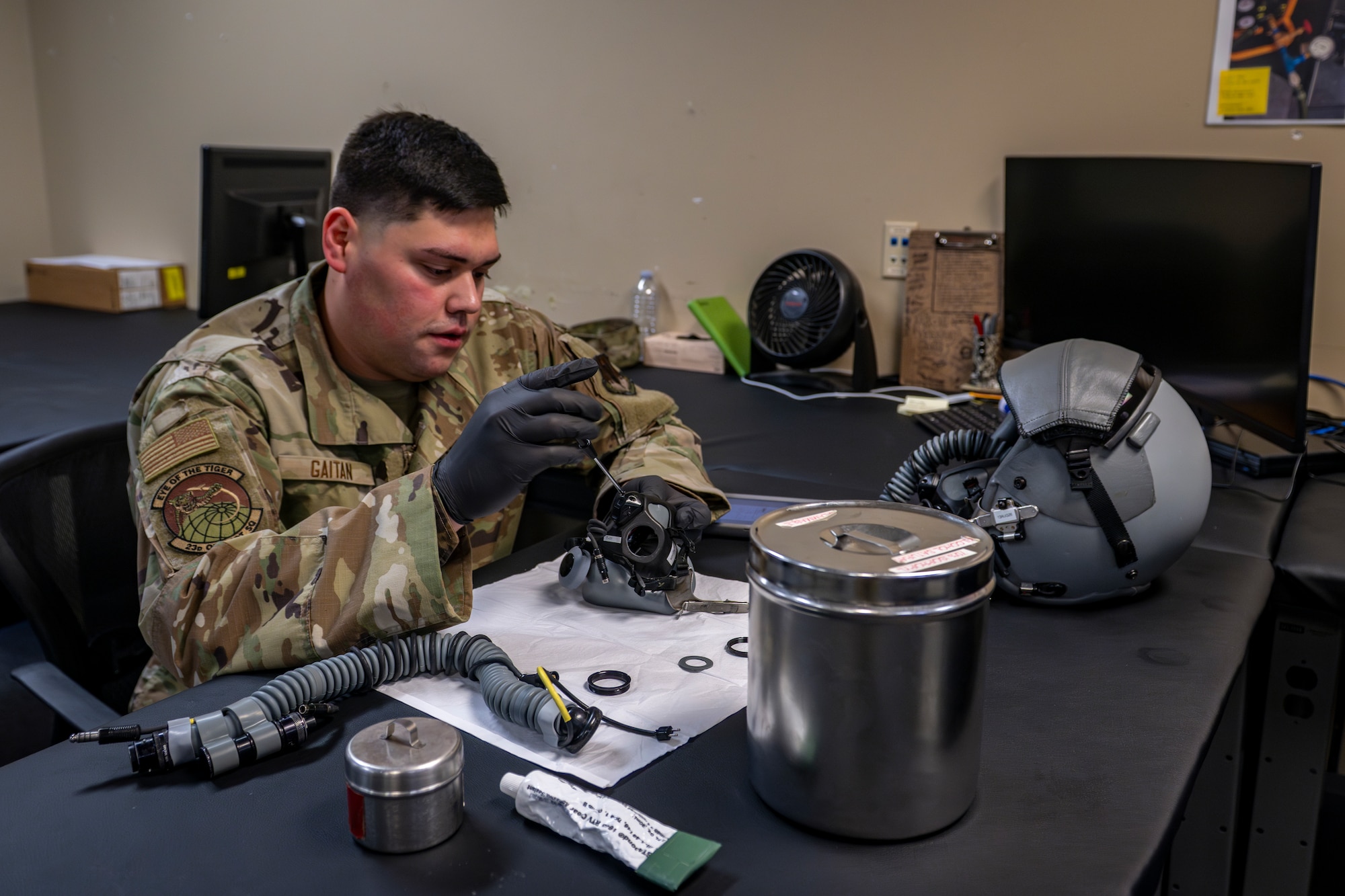 Airman working on an oxygen mask
