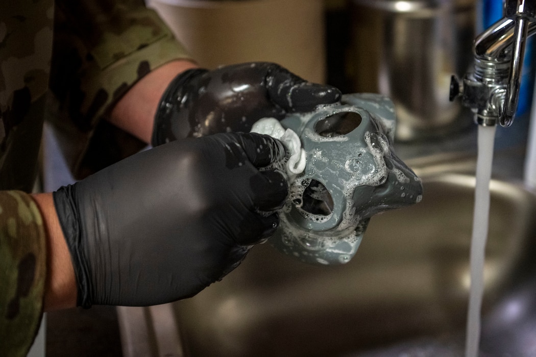 Airman cleaning gear