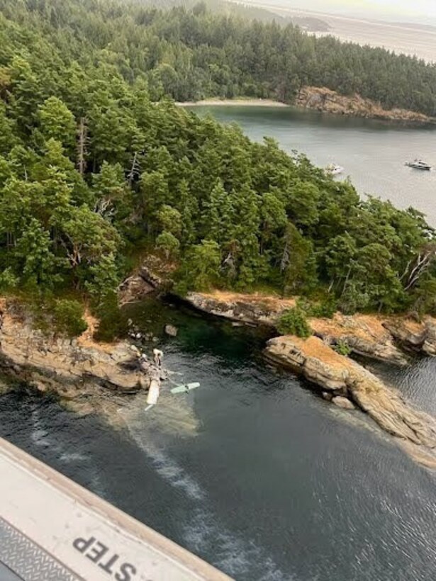 Debris sits against the rocks of Sucia Island, Washington, after a seaplane conducted an emergency landing