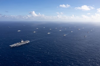 The Nimitz-class aircraft carrier USS Theodore Roosevelt (CVN 71) leads a group sail July 22, 2026, in the Pacific Ocean off the coast of Hawaii during Exercise Rim of the Pacific 2026.