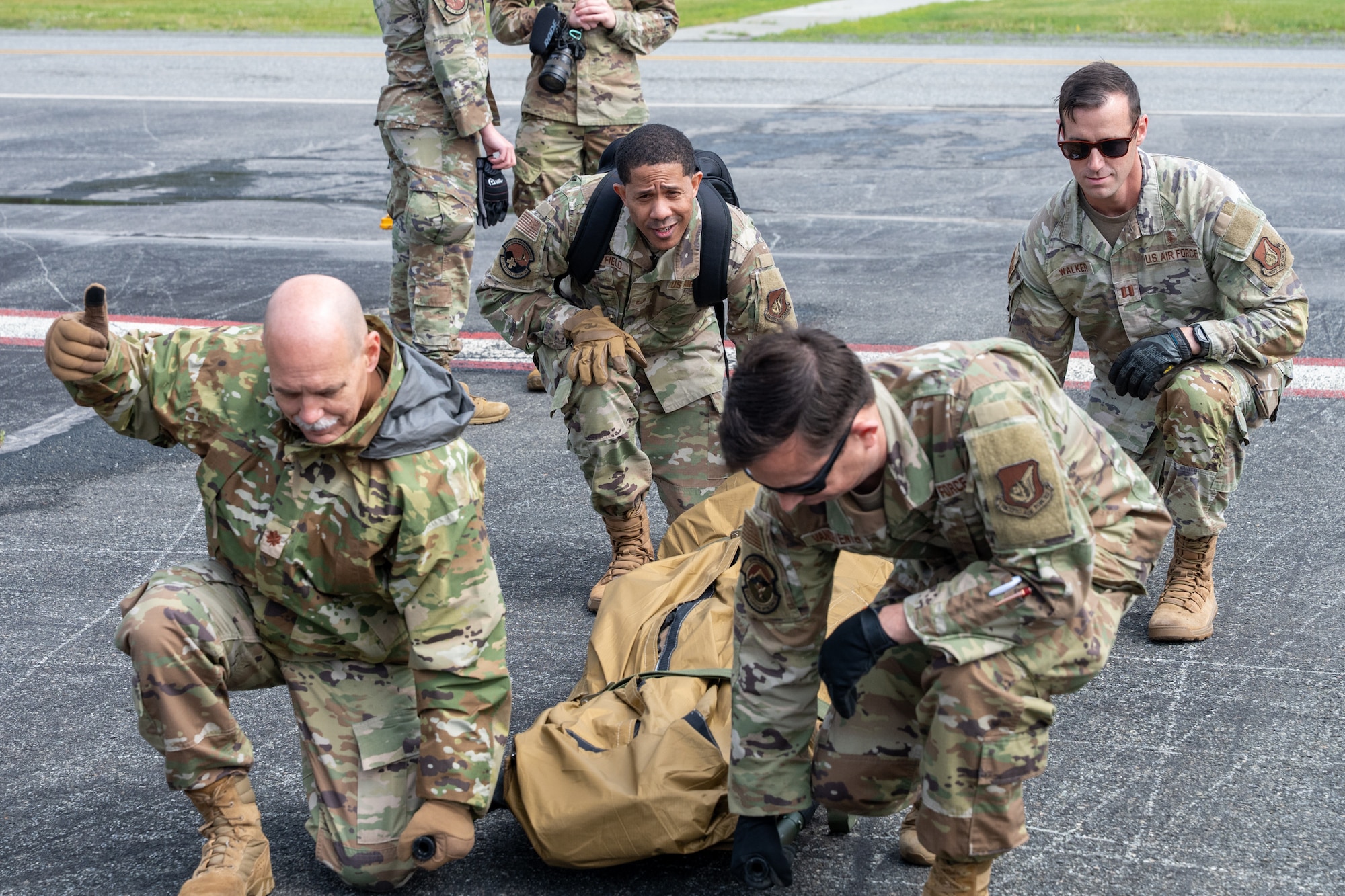 U.S. Air Force Airmen, assigned to the 673d Medical Group, conduct a litter carry to a dropzone during a medical evacuation exercise at Joint Base Elmendorf-Richardson, Alaska, July 15, 2026.