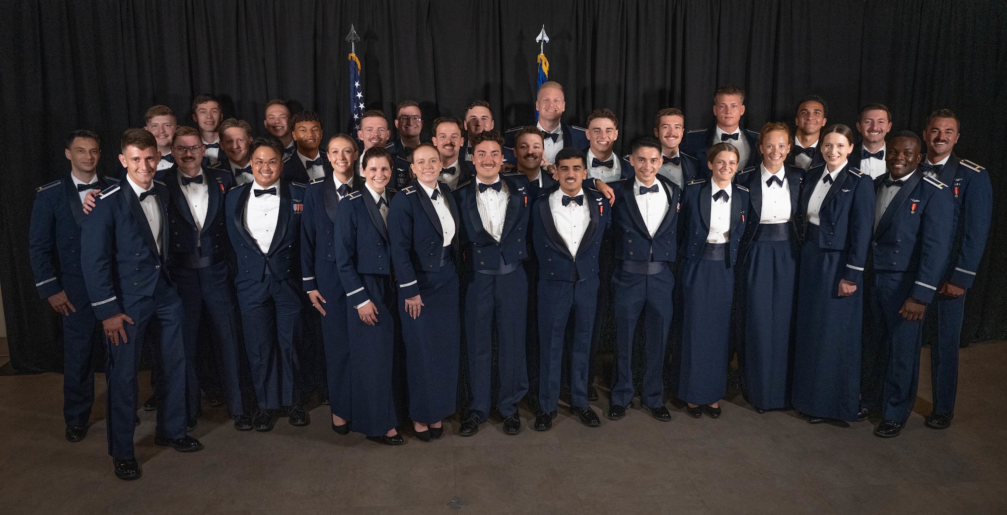 Student pilots from graduating Undergraduate Pilot Training (UPT) Class 26-14 and 26-12 AU come together for a group photo at Laughlin Air Force Base, Texas, July 23, 2026. Thirty U.S. Air Force officers were recognized for successfully completing UPT during a graduation ceremony. (U.S. Air Force photo by Airman 1st Class Darryl Keith)