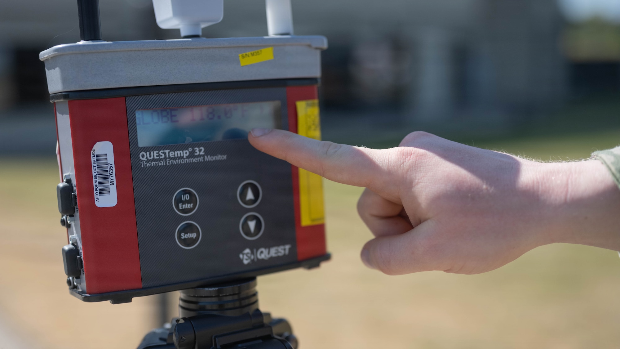 An Airman uses a QUESTemp 32 Area Heat Stress Monitors to measure air temperature, humidity, wind speed and sun angle at Spangdahlem Air Base, Germany, June 25, 2026. During periods of high heat, the team relays measurements to the wing's command post every 30 minutes  to inform decision makers and align with personnel protection measures with current heat conditions to reduce heat related illnesses. (U.S. Air Force photo by Staff Sgt. Darius Frazier)