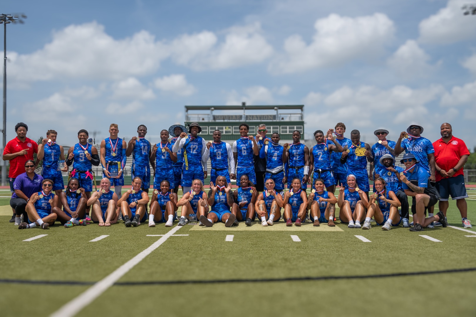 U.S. Armed Forces Sports Air Force Men and Womens Flag Football teams celebrate during the Armed Forces Flag Football Championships at Cougar Stadium on Fort Sam Houston, Texas, July 25, 2026. Service members competed for championship honors while representing their respective services.
 
Armed Forces sports bring together service members from the Army, Marine Corps, Navy (with Coast Guard athletes), and Air Force (with Space Force athletes) to compete at the national level. Armed Forces Sports promotes physical fitness, provides competitive opportunities for military athletes at national and international levels, supports recruitment and retention efforts, and strengthens partnerships through sports diplomacy. (U.S. Air Force photo by Staff Sgt. Jonathan Anderson])