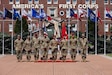 The squad representing the 11th Airborne Division stands in front of I Corps headquarters after winning the U.S. Army Pacific Best Squad Competition, July 24, 2026, at Joint Base Lewis-McChord, Wash. (U.S. Army photo by Staff Sgt. Kylee Marshall)