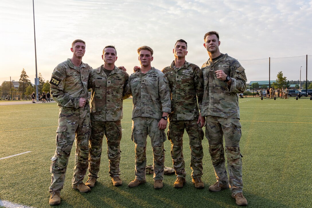 U.S. Army Soldiers assigned to the 11th Airborne Division stand together after completing a fitness circuit event during the U.S. Army Pacific Best Squad Competition, July 21, 2026, at Joint Base Lewis-McChord, Wash.