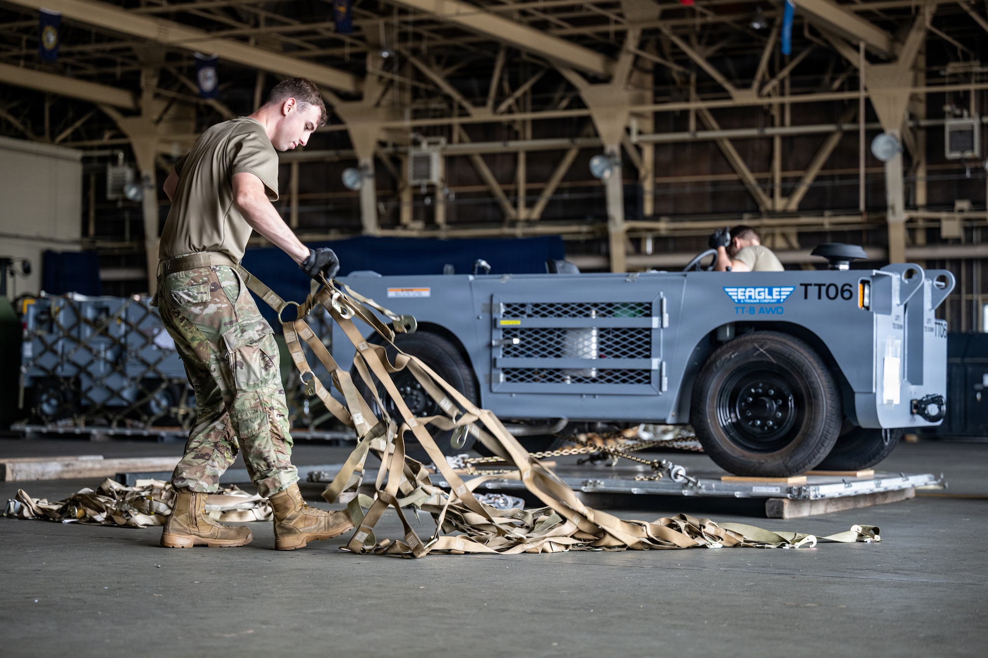 U.S. Air Force Senior Airman Kyle Graff, 35th Logistics Readiness Squadron air transportation function journeyman, prepares to secure cargo in support of Red Flag-Alaska 26-3.