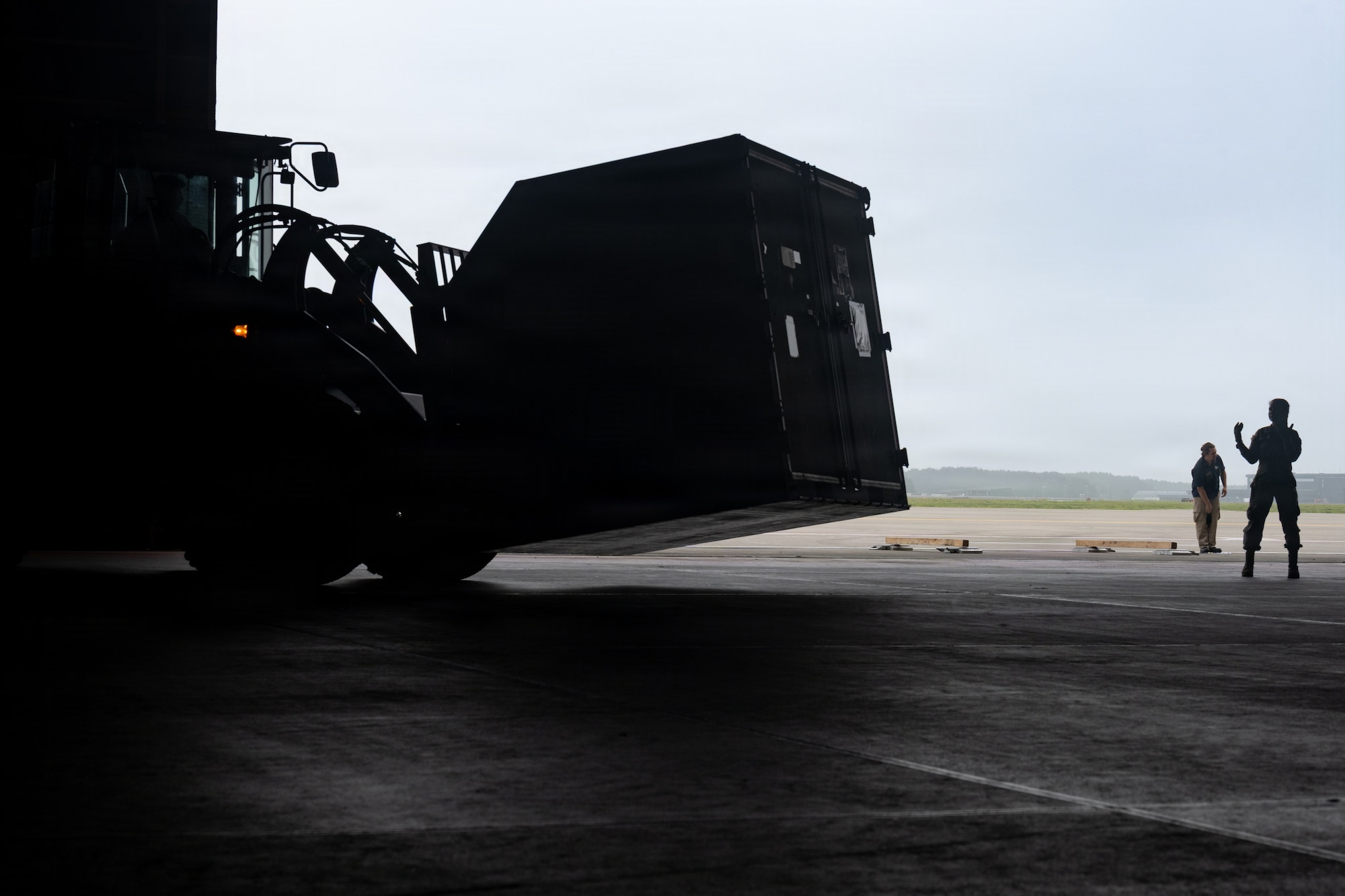 U.S. Air Force Senior Airman Destiny Ross, 35th Logistic Readiness Squadron inbound cargo technician, guides a forklift carrying cargo in support of Red Flag-Alaska 26-3.