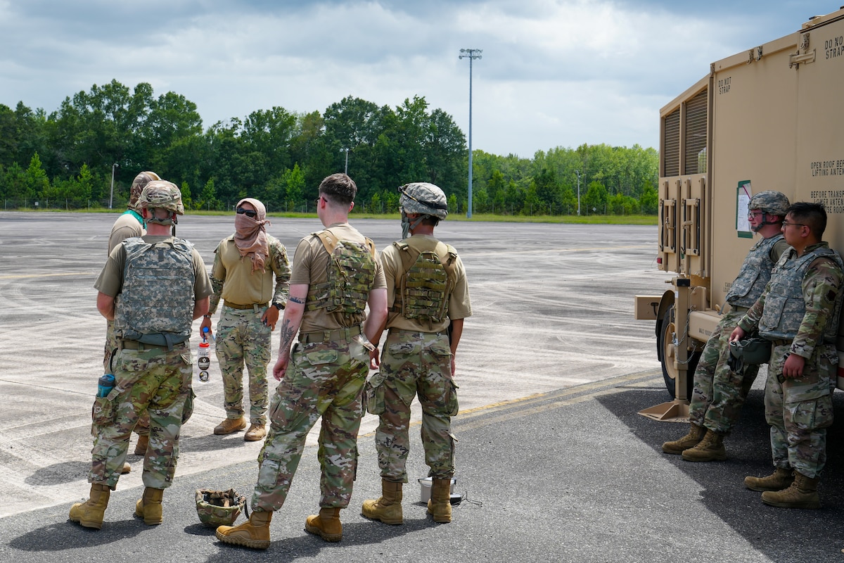 Airmen from the 53rd Combat Airfield Operations Squadron Demand Force Team Alpha execute an after-action debrief during a certification event at Robins Air Force Base, Georgia, July 21, 2026.