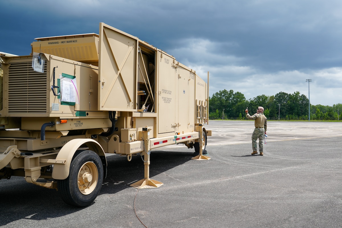Master Sgt. Kristian Penafiel, 53rd Combat Airfield Operations Squadron Radar Airfield and Weather Systems technician, simulates a spectator taking photos for social media during a certifying event at Robins Air Force Base, Georgia, July 21, 2026.