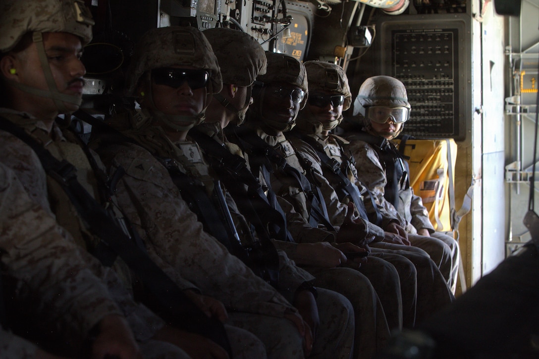 U.S. Marines on an MV-22B Osprey, a tiltrotor aircraft with Marine Medium Tiltrotor Squadron (VMM) 764, Marine Aircraft Group 41, 4th Marine Aircraft Wing, prepare for takeoff during Integrated Training Exercise 3-26, Marine Corps Air-Ground Combat Center Twentynine Palms, California, June 12, 2026. ITX is designed to generate combat readiness and ensure the Reserve Component provides critical strategic depth to the Total Force. From complex combined arms maneuvers to all-domain integration, these Marines are proving that they are ready to augment, reinforce and fight alongside the active component at a moment's notice. (U.S. Marine Corps photo by Cpl. Donnell Brown)