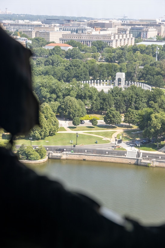A U.S. Marine assigned to Marine Medium Tiltrotor Squadron (VMM) 774, 4th Marine Aircraft Wing, observes the surroundings of the National Mall during a flyover rehearsal as part of the Great American State Fair in Washington, D.C., July 3, 2026. The Great American State Fair is a national celebration of America's 250th anniversary, bringing together all 50 states and U.S. territories on the National Mall to showcase the people, innovation, history, and traditions that have shaped the Nation over the past two and a half centuries. (U.S. Marine Corps photo by Staff Sgt. Joshua Smith)
