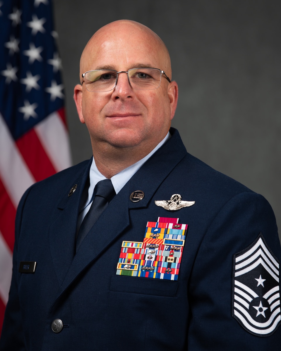 Chief Master Sergeant Brandon A. Bitler is Command Chief, Air Force Technical Applications Center, Patrick Space Force Base, Fla.  He advises the AFTAC wing commander on matters concerning the readiness, utilization, training, morale, and welfare of the 1,100-member center and its 14 detachments around the globe in support of AFTAC’s international nuclear treaty monitoring activities.  AFTAC operates and maintains the United States Atomic Energy Detection System to monitor foreign compliance with various treaties limiting nuclear testing.  AFTAC is also the designated U.S. laboratory system that provides technical support to the United Nations’ International Atomic Energy Agency.