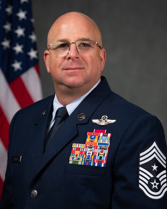 Chief Master Sergeant Brandon A. Bitler is Command Chief, Air Force Technical Applications Center, Patrick Space Force Base, Fla.  He advises the AFTAC wing commander on matters concerning the readiness, utilization, training, morale, and welfare of the 1,100-member center and its 14 detachments around the globe in support of AFTAC’s international nuclear treaty monitoring activities.  AFTAC operates and maintains the United States Atomic Energy Detection System to monitor foreign compliance with various treaties limiting nuclear testing.  AFTAC is also the designated U.S. laboratory system that provides technical support to the United Nations’ International Atomic Energy Agency.