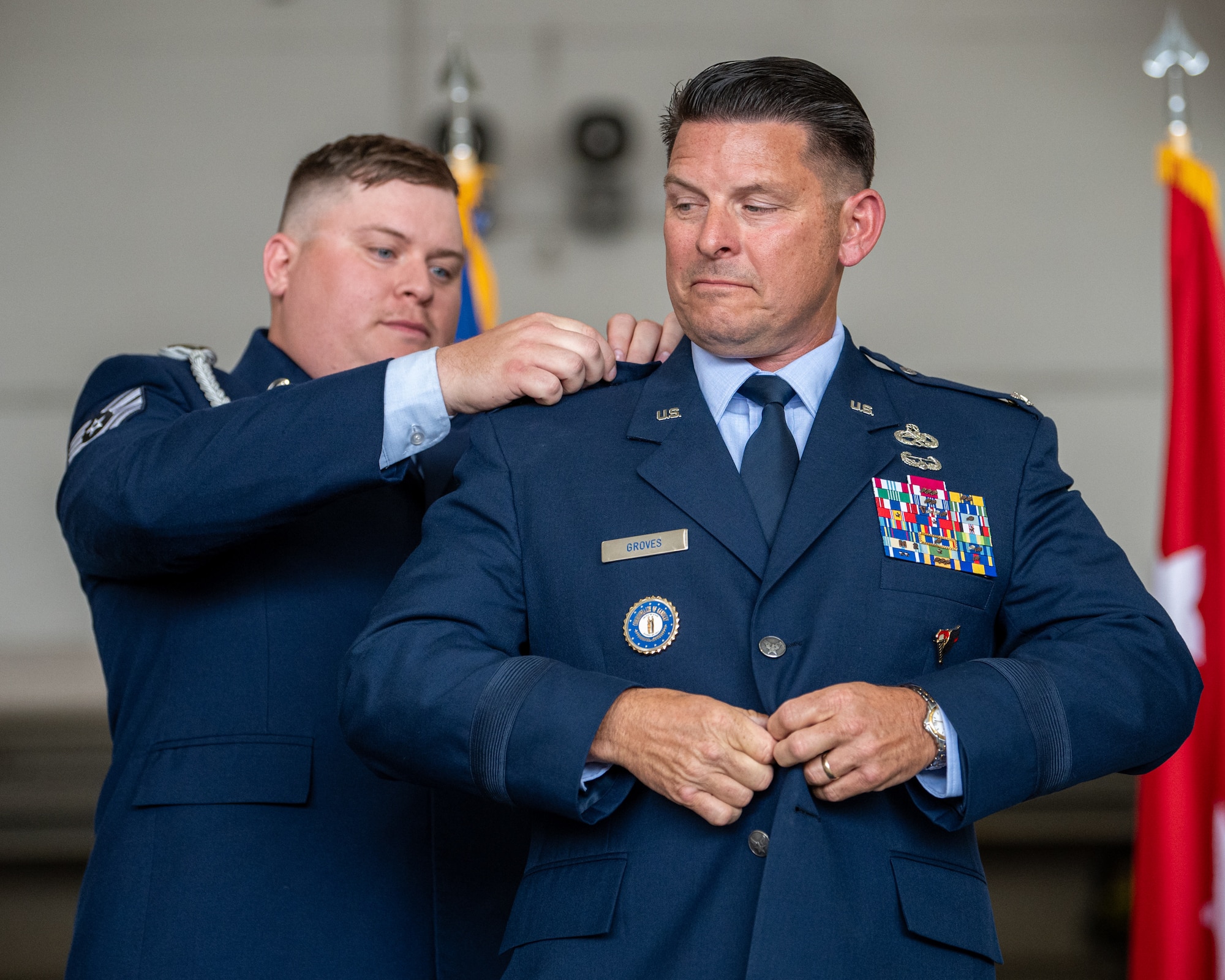 Col. Ash Groves, right, chief of the Air staff at Joint Force Headquarters-Kentucky, is pinned with the rank of brigadier general by a family member during a promotion ceremony at the Kentucky Air National Guard Base in Louisville, Ky., June 7, 2026. Groves previously served as headquarters’ director of Air staff. (U.S. Air National Guard photo by Senior Airman Annaliese Billings)