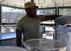 U.S. Army Reserve Sgt. Abel Owusu, a culinary specialist with the 880th Quartermaster Company, prepares an evening meal for exercise participants during Operation Bold Eagle at Fort Hunter Liggett, California, July 17, 2026. The mission of the 880th QM Company is to feed the force by providing field feeding and culinary support, using equipment like the mobile kitchen trailer to sustain troops during training and deployments. 

Bold Eagle is a premier multi-echelon training exercise providing mission command for 74 units and over 3,300 participating Soldiers. This training event includes a combat support training exercise and Global Medic, which prepares forces for large scale combat operations. Bold Eagle immerses participating units in a rigorous multi-domain operations environment. (U.S. Army photo by Sgt. 1st Class Rodney Roldan)