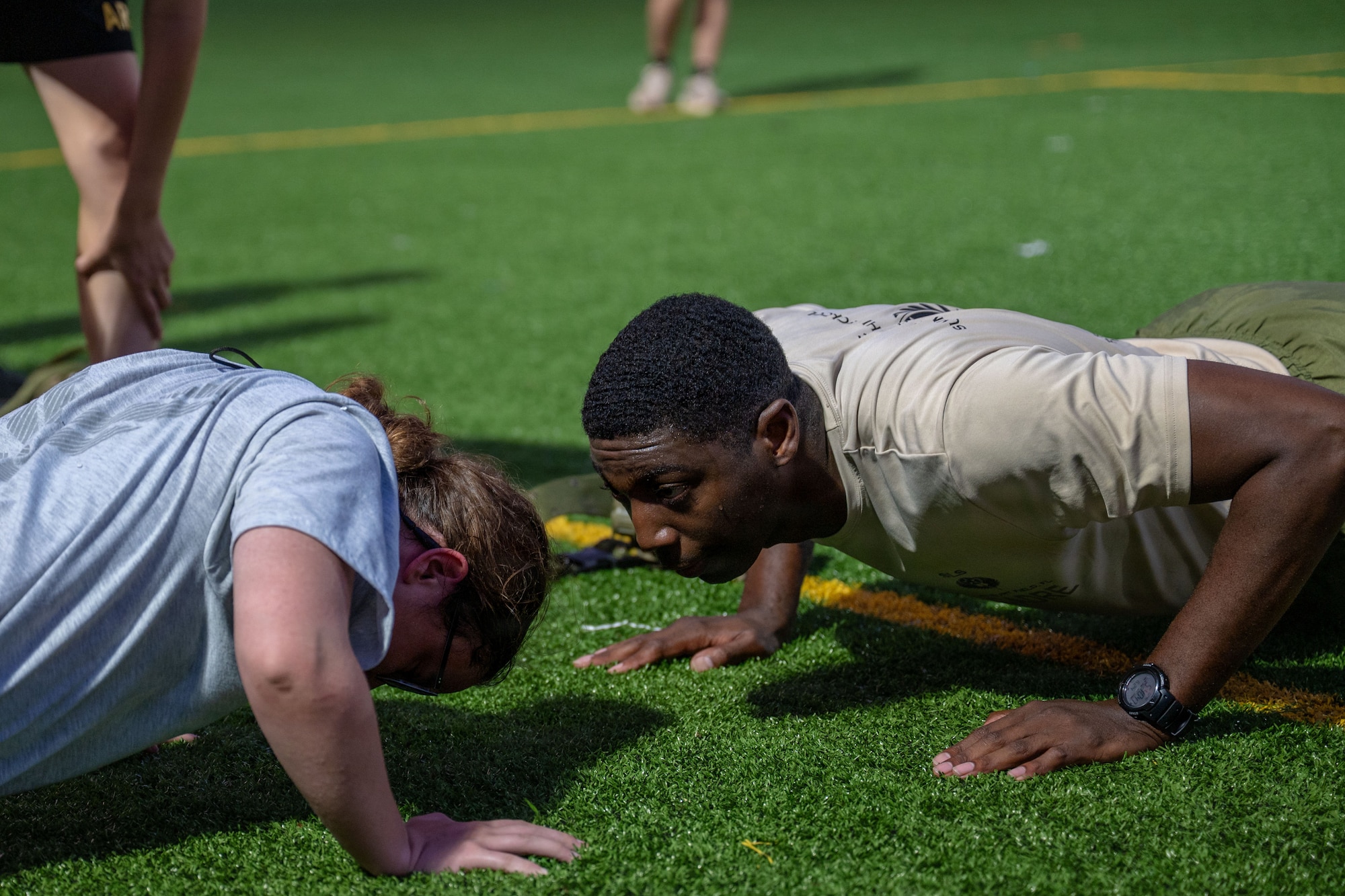 U.S. Marine Corps Staff Sgt. Bryan Caldwell, Summer Leadership School mentor, coaches a cadet through pushups during SLS at Hurlburt Field, Florida, June 24, 2026.
