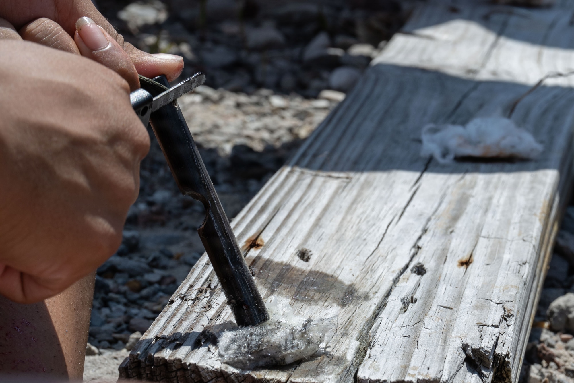 A Junior ROTC cadet attempts to start a fire during Summer Leadership School at Hurlburt Field, Florida, June 25, 2026.