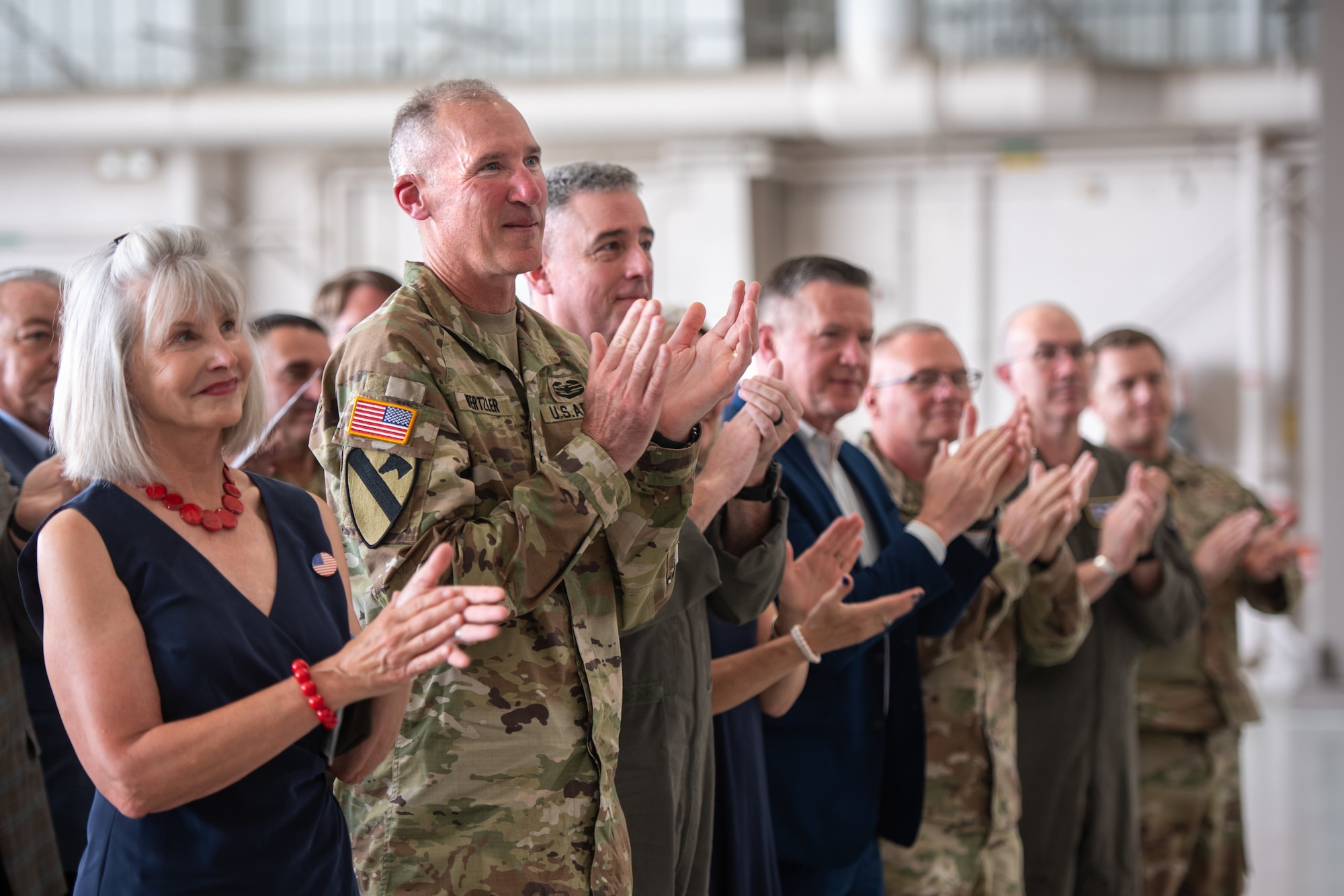 Friends, family and fellow service members attend a ceremony promoting Col. Ash Groves to the rank of brigadier general at the Kentucky Air National Guard Base in Louisville, Ky., June 7, 2026. Groves, who previously served as director of the Air staff at Joint Force Headquarters-Kentucky, is now chief of the Air staff at JFHQ-KY. (U.S. Air National Guard photo by Tech. Sgt. Chloe Ochs)