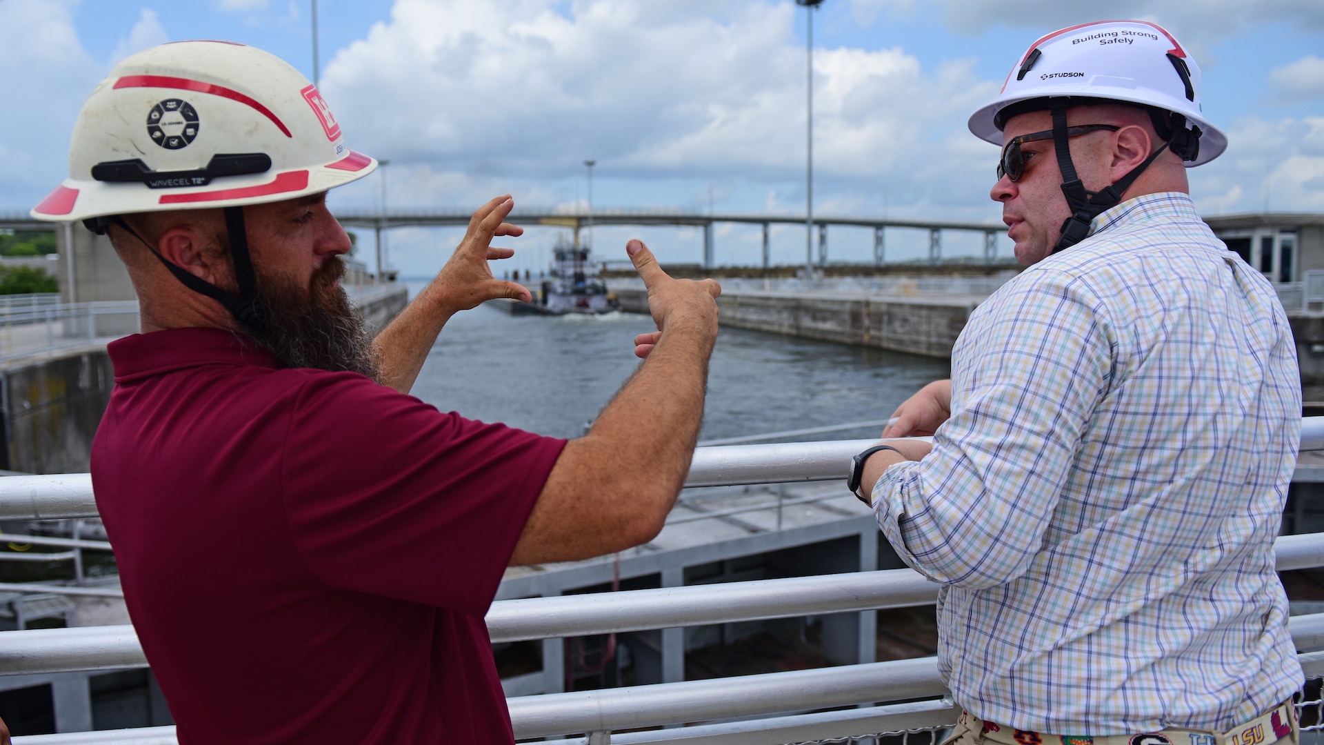 Maintenance Engineer Josh Garcia (Left), U.S. Army Corps of Engineers Nashville District, provides information about the life cycle and material makeup of miter gates and components while interacting with Assistant Secretary of the Army for Civil Works Adam Telle during a site visit July 20, 2026, at Wilson Lock on the Tennessee River in Florence, Alabama. (USACE Photo by Lee Roberts)