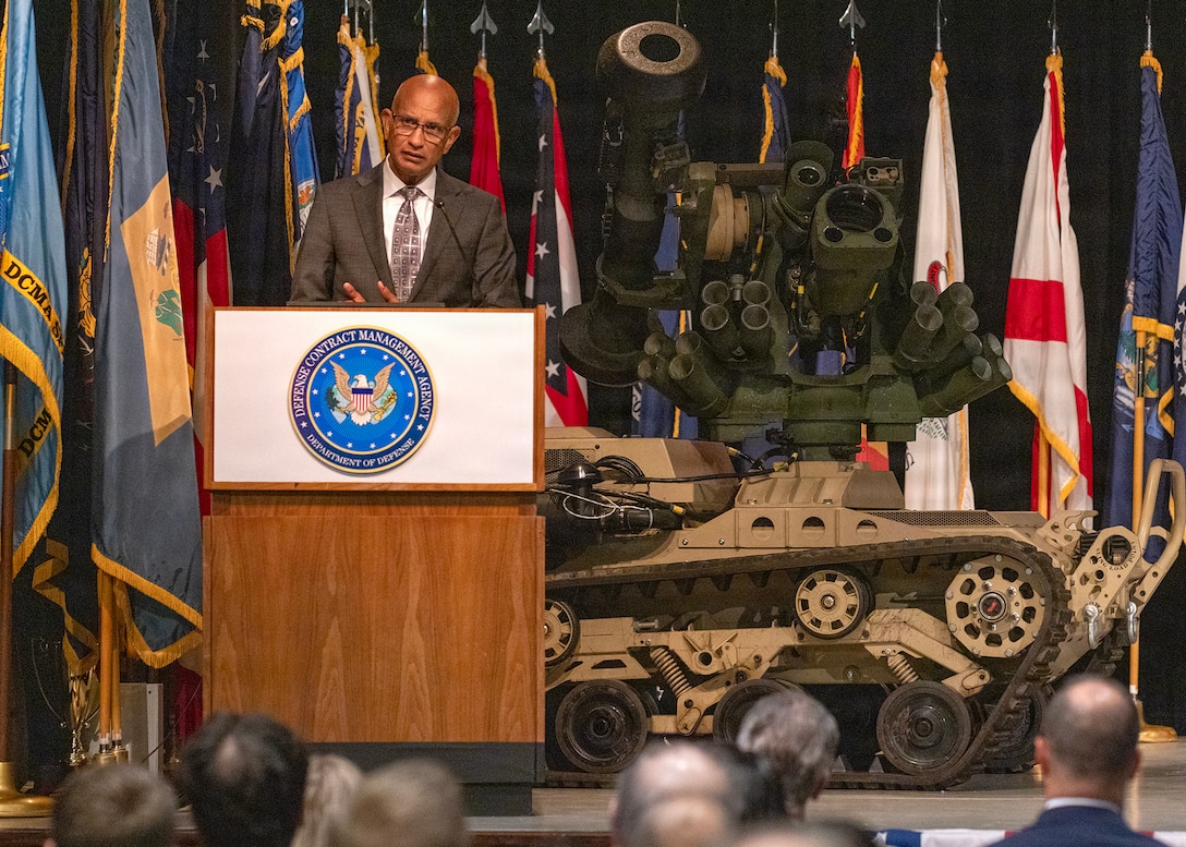 PICATINNY ARSENAL, N.J. - Jorge Bennett, Systems Command Executive Director, speaks as Col. Ernesto Perez assumed command of the Defense Contract Management Agency (DCMA) Springfield during a formal change of command ceremony held July 2 at Picatinny Arsenal's Lindner Conference Center. U.S. Army photo by Todd Mozes